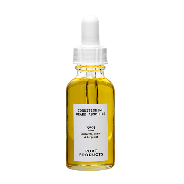 Conditioning Beard Absolute  glass bottle of gold oil with dropper on white background